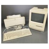 Vintage Macintosh Classic computer with printer-