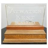 Antique Atwater Kent glass advertising sign on a