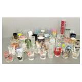 Collection of over 60 souvenir shot glasses, etc.