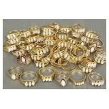 Group over 50 goldtone rings s/w opals- assorted