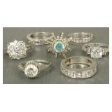 7 fancy sterling silver rings s/w cz's, colored