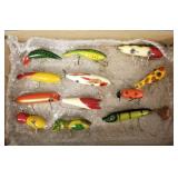 12 vintage fishing lures incl Heddon flap-tail,