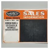 Metal advertising United Farm Agency sign with
