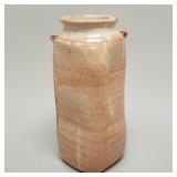 Warren MacKenzie tall shino glaze vase with small