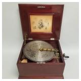 Regina music box with seven- 12" discs (working)