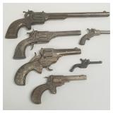 6 cast iron toy cap guns incl Cowboy, 6 Shot
