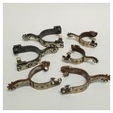 3 pair spurs with ornate silver toned metal