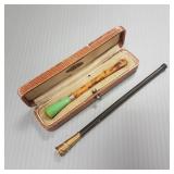 2 Dunhill, etc 9k gold trimmed cigarette holders-