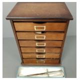 6 drawer table top cabinet w/ cigarette holders,