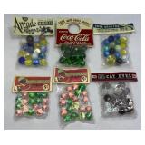 (6) PACKAGES OF MARBLES