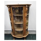 CURVED GLASS CURIO CABINET W/ LION HEAD ACCENTS