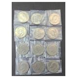 (12) UNCIRCULATED EISENHOWER DOLLARS, MIXED DATES