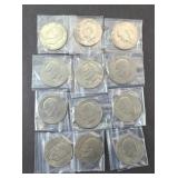 (12) UNCIRCULATED EISENHOWER DOLLARS, MIXED DATES