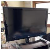 LG FLAT SCREEN 26 INCH TV, HAS ROKU, WORKS