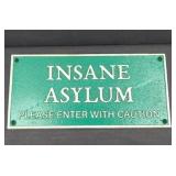 CAST IRON INSANE ASYLUM SIGN