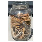 GALLON JAR OF CLOTHES PINS