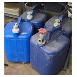 (4) COLEMAN WATERING CANS