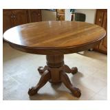 OAK PEDESTAL TABLE W/ (1) LEAF, HAS SOME WEAR