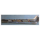 (4) HOCKEY STICKS