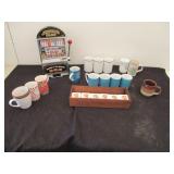 Slot Machine, Spice Rack and Coffee Cups