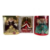Three Holiday Barbie Dolls