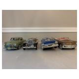 Four Diecast Cars and Trucks