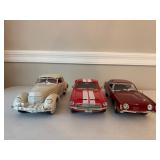 Three Diecast Cars and Trucks