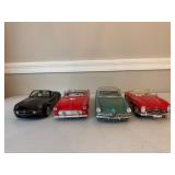 Four Diecast Cars and Trucks