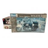 Two Sealed and One Opened Model Kits