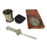 Compass, Travel Cup, and Tool