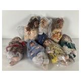 Seven Porcelain Dolls with Plastic Wrapping