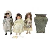 Three Porcelain Dolls and Embossed Metal Vase