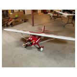 Red and White Remote-Control Biplane Model