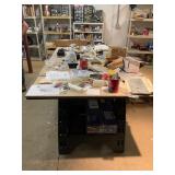 Table With Model Airplane Parts and Tools