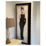 Framed Artwork Featuring Elegant Figure