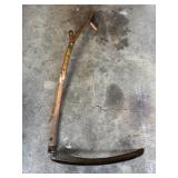Primitive scythe with wooden handle