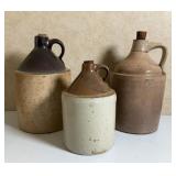 Three Glazed Stoneware Jugs with Corks