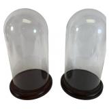 A Pair of Glass Display Domes on Wood Bases