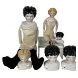 An Assortment of Antique German China Head Dolls