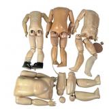 A Collection of Four Jointed Doll Bodies & Parts