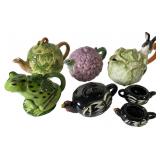 An Assortment of Seven Figural Ceramic Teapots