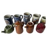 An Assortment of Beer Steins and Teapots