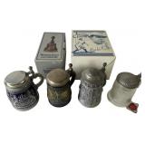 An Assortment of Lidded Steins and Goebel Bell