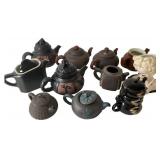 Assortment of Decorative Teapots and Wall Pocket