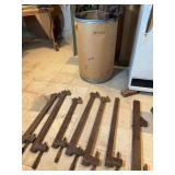 Fifteen Antique Wooden Bar Clamps and Fibre Barrel