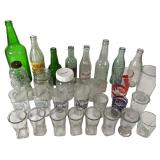 Collection of Vintage Soda Bottles and Glassware