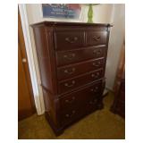 A Four Piece Traditional Style Cherry Finished Bed