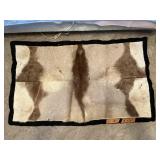 ANIMAL SKIN RUG, 32"X54" W DAMAGE