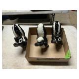 3 CERAMIC SKUNKS IN A FLAT