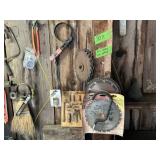 OLD TOOLS ON WALL- SAWS, SAW BLADES ETC